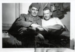 Probable platoon buddies in unidentified barracks location, most likely in France during winter of 1944.