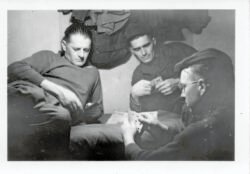 Probable platoon buddies in unidentified barracks location, most likely in France during winter of 1944.