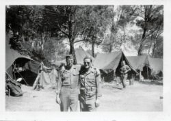 Tech 4 Lloyd V. Olson, right, with probable platoon buddy from Company B. Image thought to be shot at Calas staging area prior to troops' return from Europe.