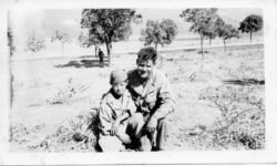 Unidenfied soldier with local lad in North Africa. Notation on back says Conde Smedon, Algeria.